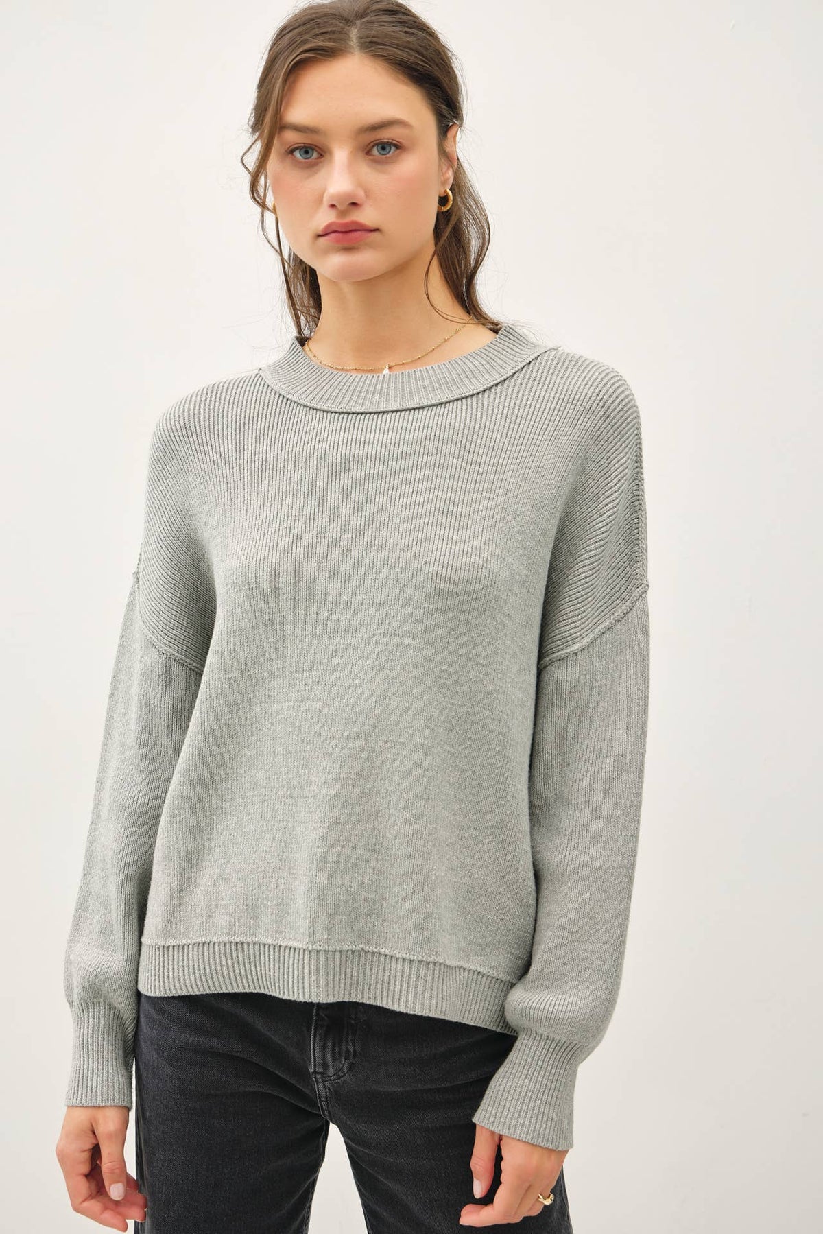 RIBBED KNIT SWEATER WITH RAW SEAM DETAILS